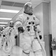 The crew of Apollo 13 walking to the transfer van